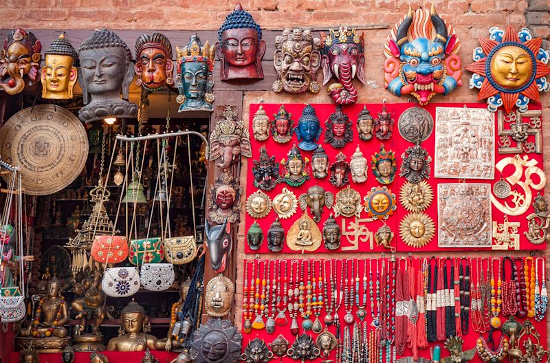 Colourful carved wooden masks and handicrafts on the traditional market in Thamel District of Kathmandu, Nepal