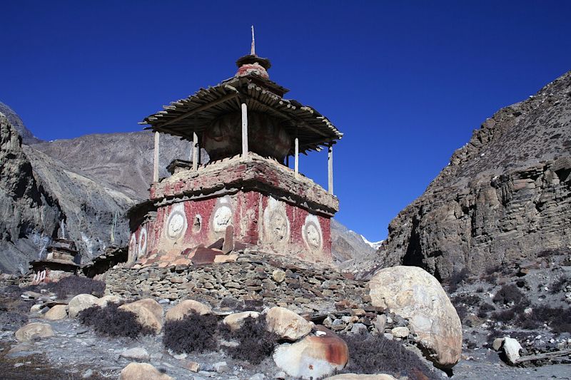 Chorten in Phu Valley, Annapurna Circuit, Nepal, with blue sky overhead