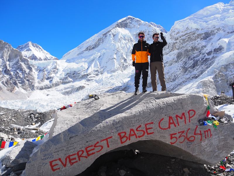 Ours. Trekkers standing aopt rock at EBC, EBC trek, Nepal