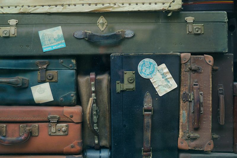 Vintage suitcases luggage sustainable travel packing list